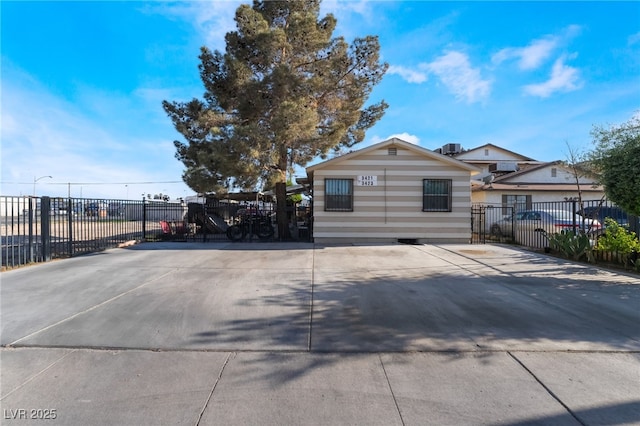 exterior space featuring fence and a gate