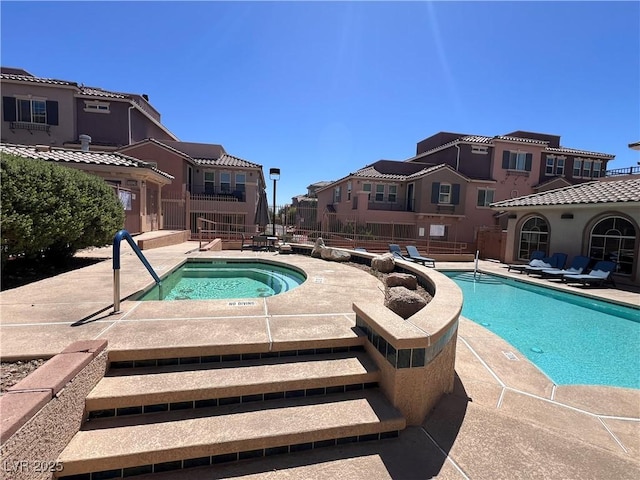 10067 Sand Key St, Las Vegas, NV 89178 - community pool featuring a hot tub and a patio area