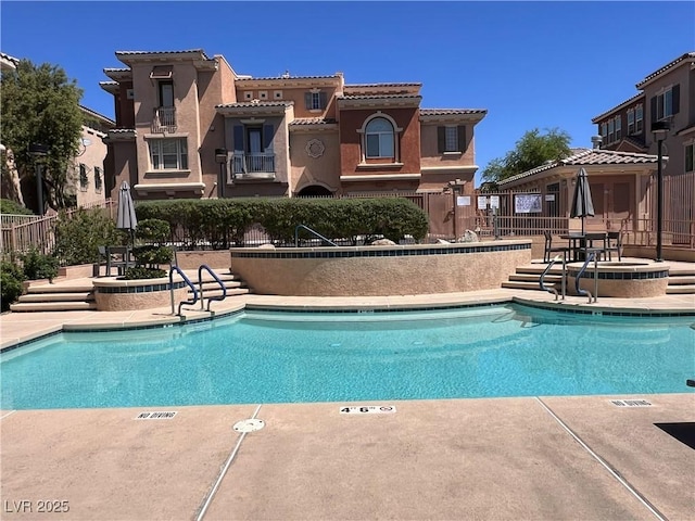 10067 Sand Key St, Las Vegas, NV 89178 - community pool with a patio