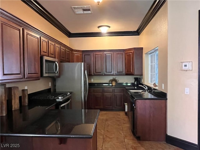 10067 Sand Key St, Las Vegas, NV 89178 - kitchen featuring stainless steel appliances, dark countertops, ornamental molding, light tile patterned floors, and a peninsula