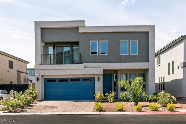 363 Terrill Ave, Las Vegas, NV 89183 - modern home featuring a garage, decorative driveway, and stucco siding