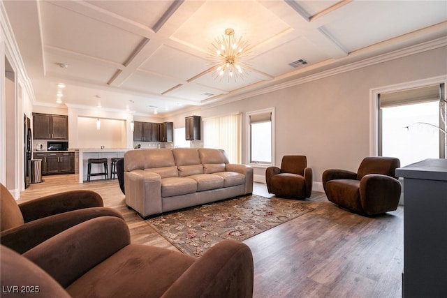 363 Terrill Ave, Las Vegas, NV 89183 - living area featuring coffered ceiling, baseboards, a notable chandelier, and light wood-style flooring