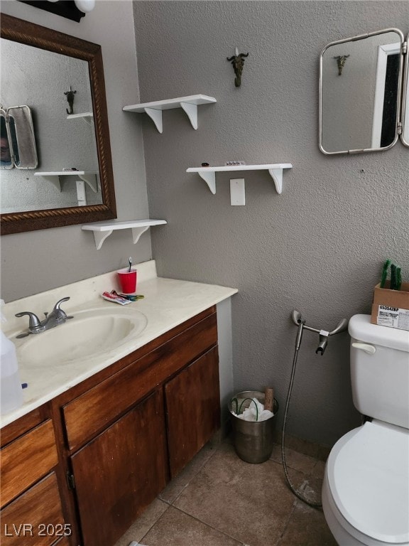 1812 Ivanhoe Way, Las Vegas, NV 89102 - bathroom featuring toilet, tile patterned flooring, and vanity