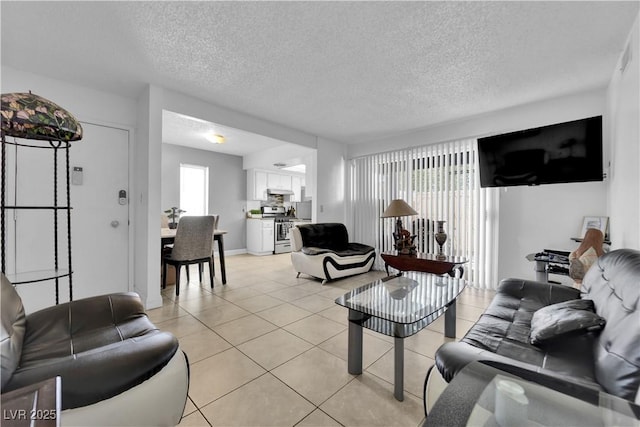 1440 Vegas Valley Dr Unit 1, Las Vegas, NV 89169 - living area with light tile patterned floors, a textured ceiling, and baseboards