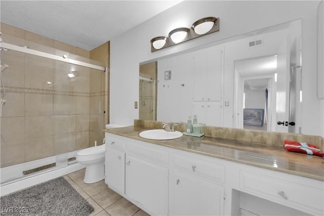 1440 Vegas Valley Dr Unit 1, Las Vegas, NV 89169 - full bath with a stall shower, toilet, tile patterned flooring, and vanity