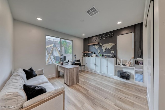 home office with baseboards, light wood-style flooring, visible vents, and recessed lighting