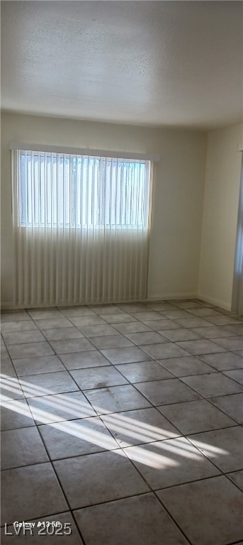 1832 Lewis Ave, Las Vegas, NV 89101 - spare room featuring light tile patterned floors and a textured ceiling