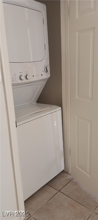 1832 Lewis Ave, Las Vegas, NV 89101 - clothes washing area with light tile patterned floors and stacked washer and dryer