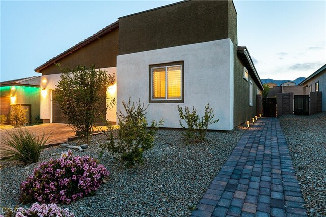 10125 Sequoia Falls Pl, Las Vegas, NV 89149 - view of home's exterior featuring stucco siding and a gate
