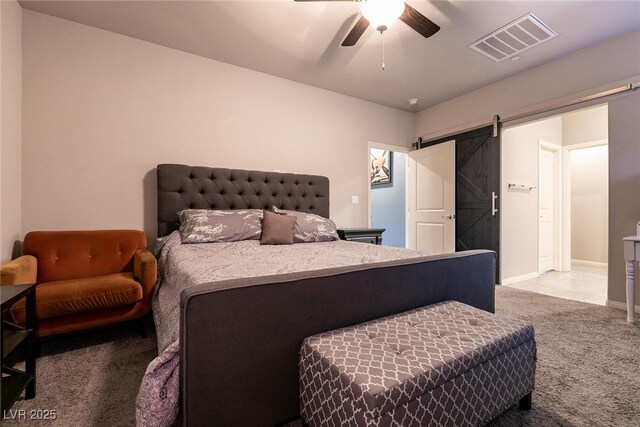 10125 Sequoia Falls Pl, Las Vegas, NV 89149 - carpeted bedroom featuring a barn door, ceiling fan, and baseboards