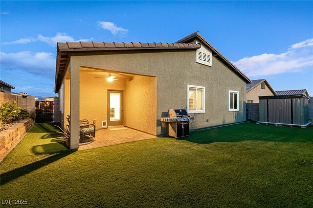 10125 Sequoia Falls Pl, Las Vegas, NV 89149 - rear view of property with a storage shed, an outdoor structure, stucco siding, and a patio area