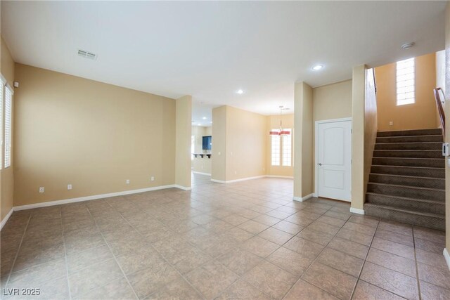 9173 Whitekirk Pl, Las Vegas, NV 89145 - unfurnished living room featuring light tile patterned floors, stairway, baseboards, and recessed lighting