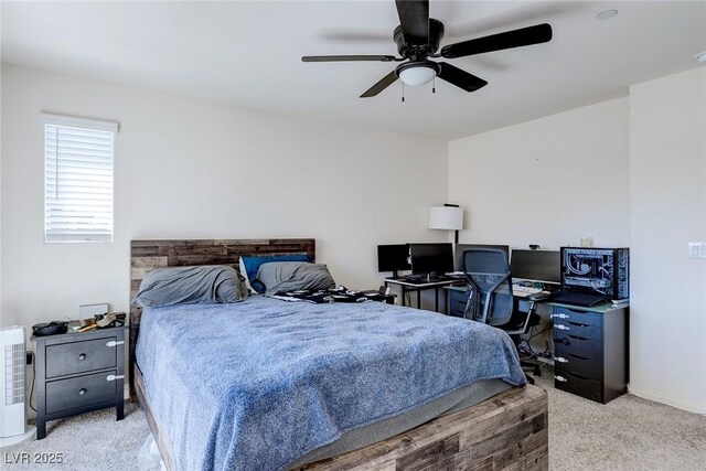 6804 Surf Green Ct, North Las Vegas, NV 89086 - carpeted bedroom featuring ceiling fan, a desk, and baseboards