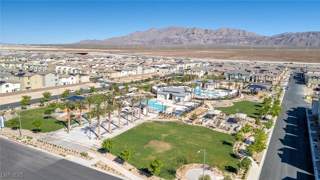6804 Surf Green Ct, North Las Vegas, NV 89086 - aerial overview of property's location featuring nearby suburban area and a mountain backdrop