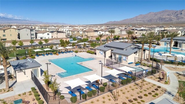 6804 Surf Green Ct, North Las Vegas, NV 89086 - view of pool featuring a residential view, a mountain view, and fence