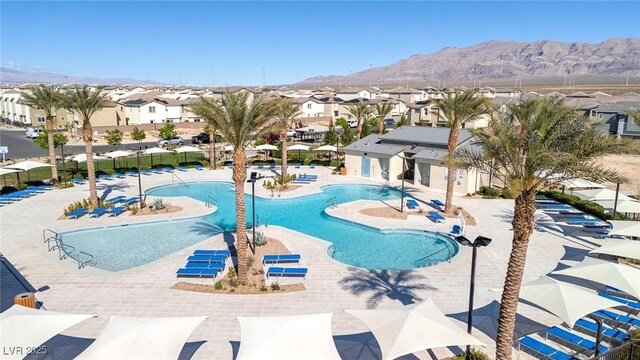 6804 Surf Green Ct, North Las Vegas, NV 89086 - community pool featuring a residential view, a mountain view, and a patio