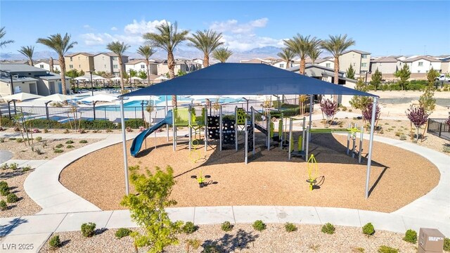6804 Surf Green Ct, North Las Vegas, NV 89086 - community jungle gym with a residential view and fence