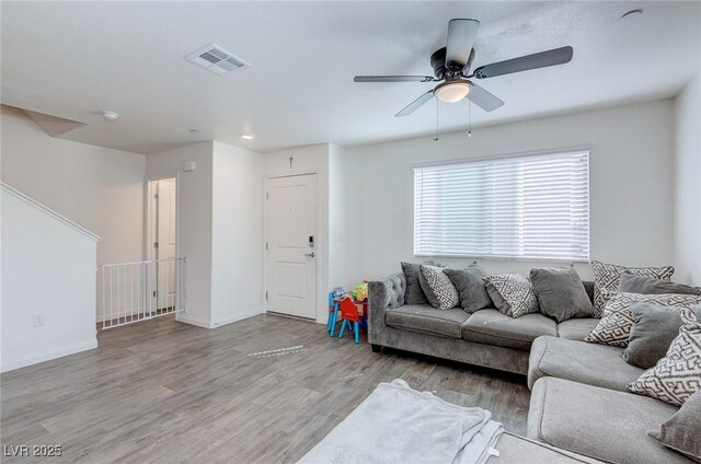6804 Surf Green Ct, North Las Vegas, NV 89086 - living area featuring wood finished floors, ceiling fan, and baseboards