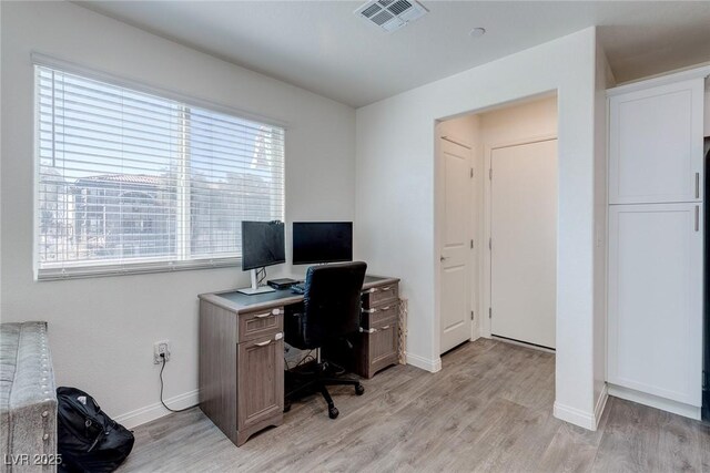 6804 Surf Green Ct, North Las Vegas, NV 89086 - office area featuring light wood-style flooring and baseboards