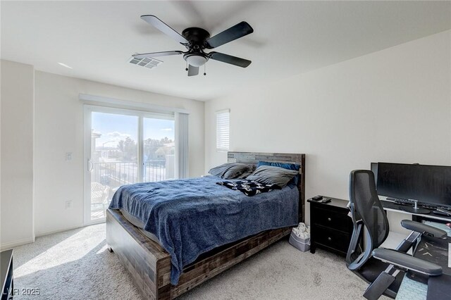 6804 Surf Green Ct, North Las Vegas, NV 89086 - carpeted bedroom featuring access to outside, a ceiling fan, an office area, and baseboards