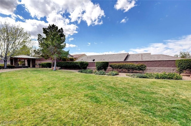 view of front of property featuring a gazebo and a front lawn