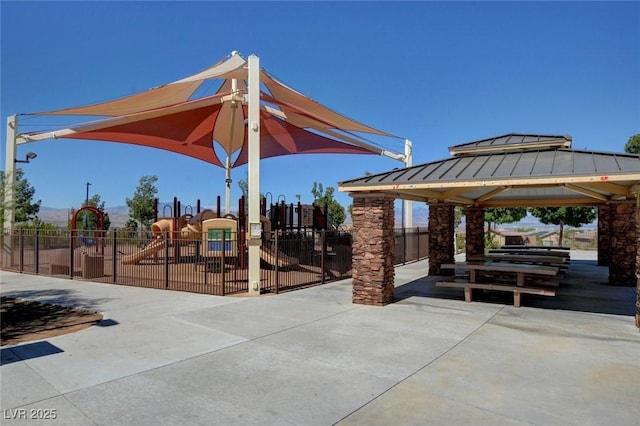 view of home's community featuring a gazebo, fence, and playground community