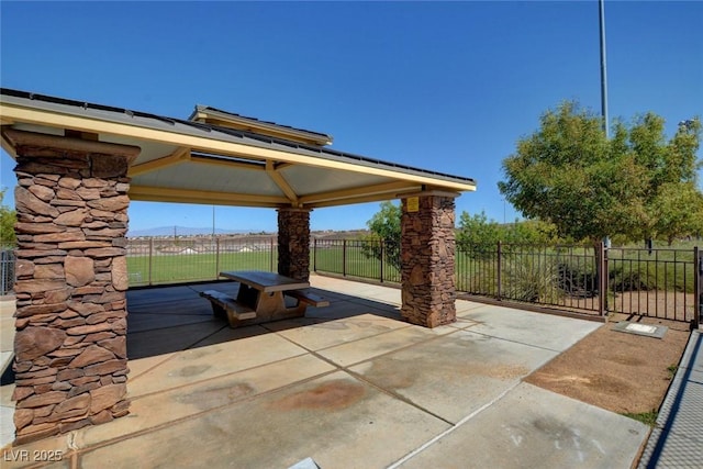 view of patio featuring a gazebo and fence
