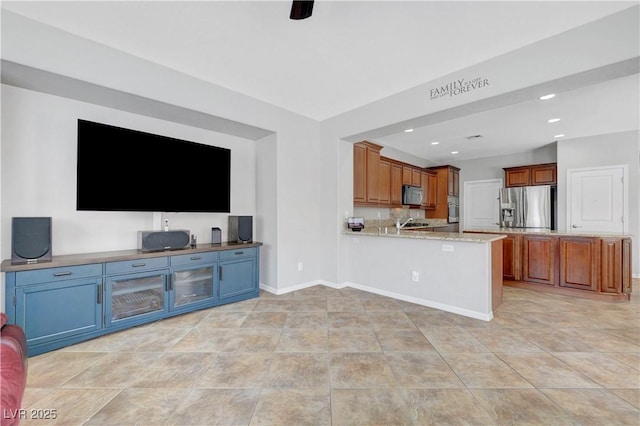 unfurnished living room featuring light tile patterned floors, baseboards, and recessed lighting