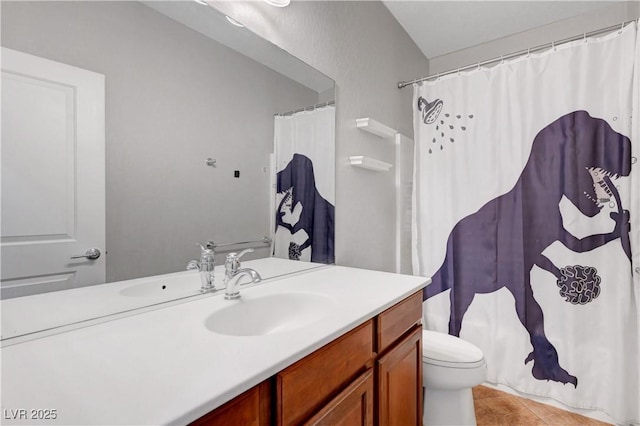 bathroom featuring vanity, a shower with shower curtain, tile patterned flooring, and toilet