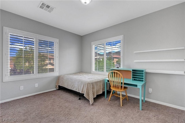bedroom featuring carpet flooring, baseboards, and visible vents