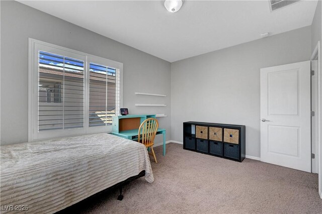 bedroom with carpet floors, baseboards, and visible vents