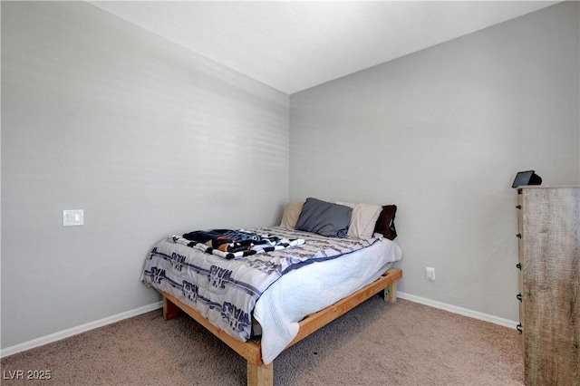 carpeted bedroom with baseboards