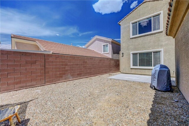 view of yard with a patio and a fenced backyard