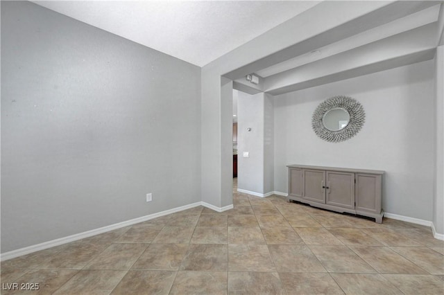 tiled empty room with baseboards