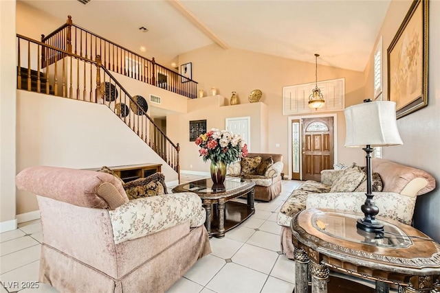 living room featuring baseboards, visible vents, stairway, and light tile patterned floors