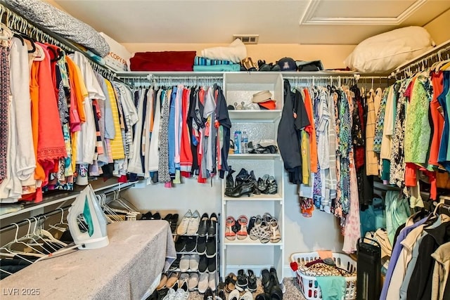 spacious closet with attic access and visible vents