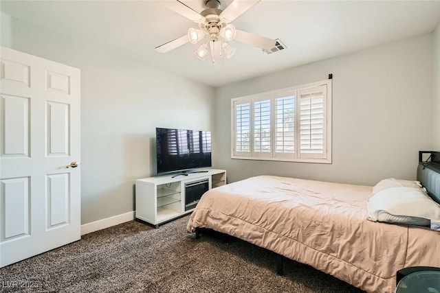 bedroom featuring carpet floors, baseboards, ceiling fan, and visible vents