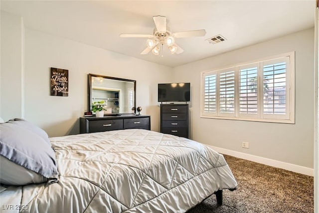 carpeted bedroom with baseboards, ceiling fan, and visible vents