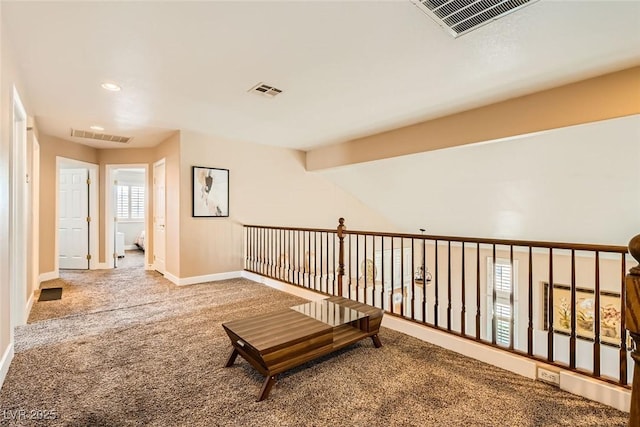 hall featuring baseboards, carpet flooring, visible vents, and recessed lighting
