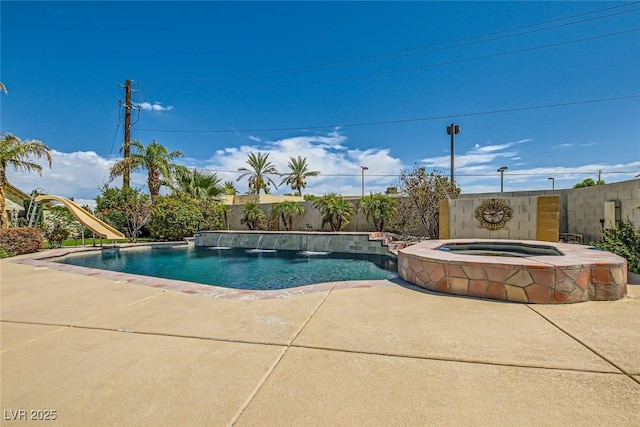 view of pool featuring a fenced backyard, an in ground hot tub, a patio, and a fenced in pool