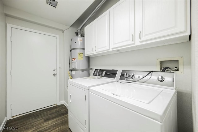 laundry room featuring dark wood-type flooring, strapped water heater, washing machine and dryer, and cabinet space