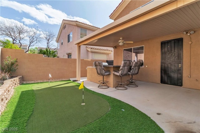 6790 Gold Yarrow St, Las Vegas, NV 89148 - view of patio / terrace featuring a putting green and a ceiling fan