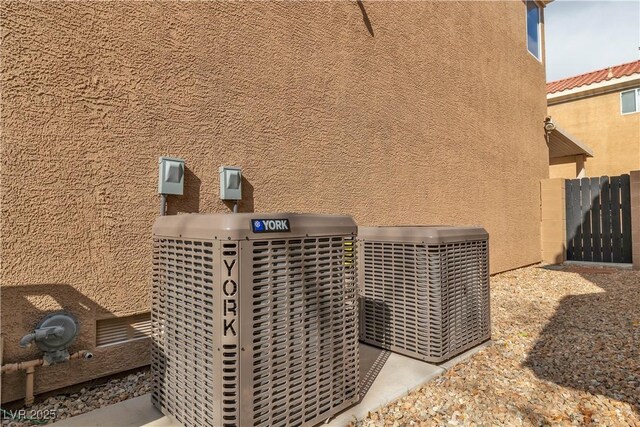 6790 Gold Yarrow St, Las Vegas, NV 89148 - exterior view of stucco siding and a central air condition unit