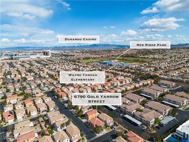 6790 Gold Yarrow St, Las Vegas, NV 89148 - aerial perspective of suburban area with a mountain backdrop