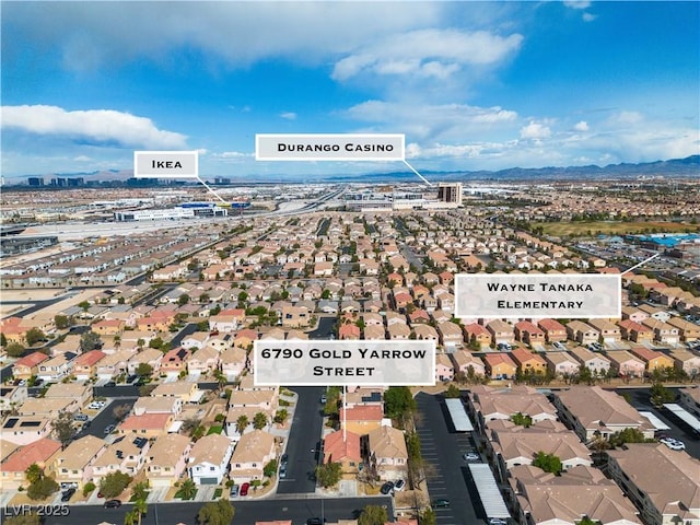 6790 Gold Yarrow St, Las Vegas, NV 89148 - aerial overview of property's location with a mountain backdrop and nearby suburban area