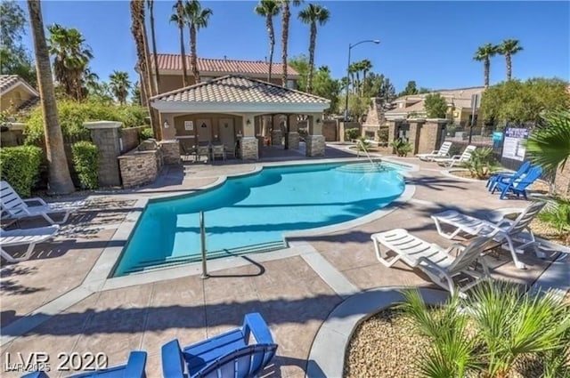 6790 Gold Yarrow St, Las Vegas, NV 89148 - community pool featuring a patio area