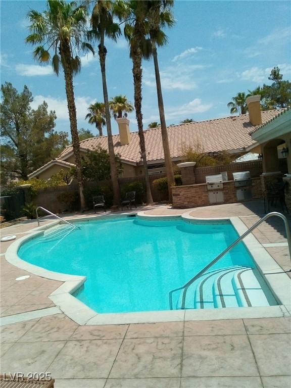 6790 Gold Yarrow St, Las Vegas, NV 89148 - view of pool featuring an outdoor kitchen and a patio area