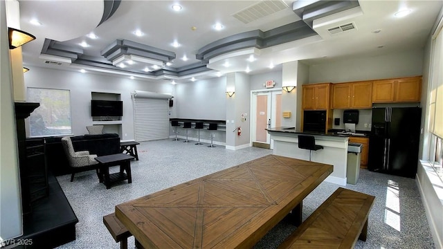 living room with recessed lighting, visible vents, and baseboards