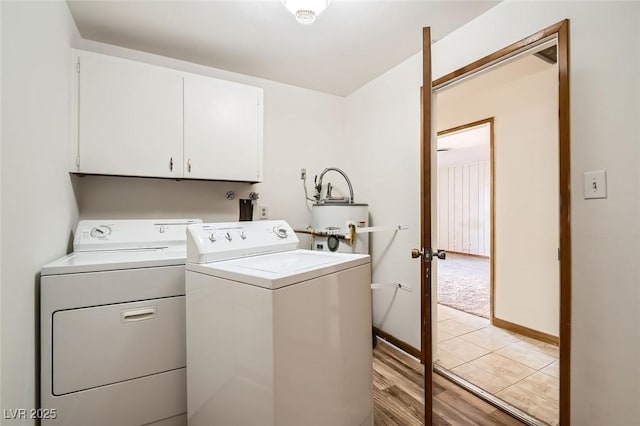 422 Ilmenite Way, Henderson, NV 89015 - washroom featuring water heater, light wood finished floors, washing machine and clothes dryer, baseboards, and cabinet space