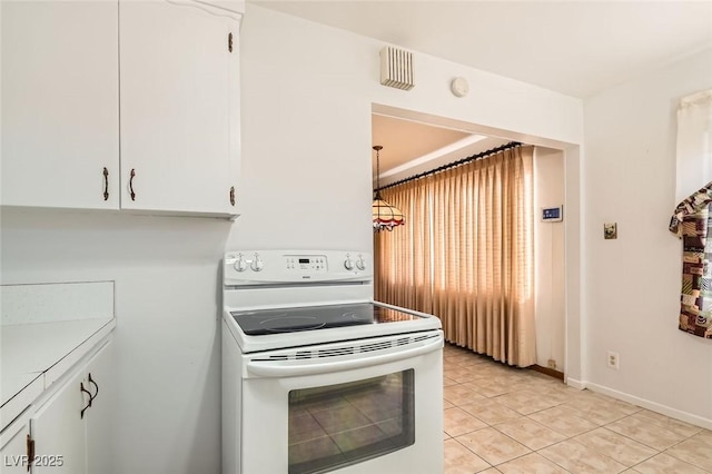 422 Ilmenite Way, Henderson, NV 89015 - kitchen featuring white range with electric cooktop, light tile patterned floors, white cabinetry, and baseboards